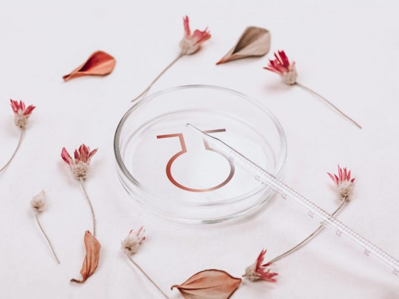 Abstract cosmetic laboratory. Bottles of dark amber glass on a white background organic flax. Natural cosmetics for care, homeopathy. Flat style, top view.